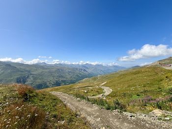 Scenic view of mountains against clear blue sky