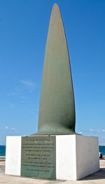 Low angle view of statue against clear blue sky