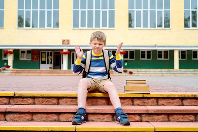 Full length of boy in building
