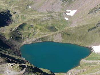 High angle view of sea and mountains against sky