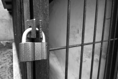 Close-up of padlock on metal