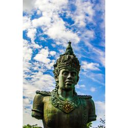 Low angle view of statue against blue sky