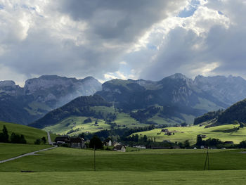 Scenic view of landscape and mountains against sky