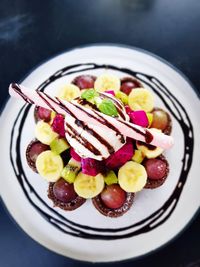 High angle view of fruits in plate on table