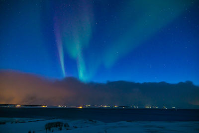 Scenic view of sea against sky at night