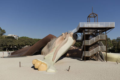 Built structure on beach against sky