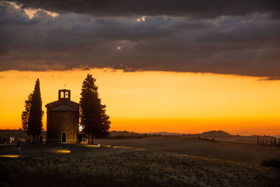 Scenic view of field against sky during sunset