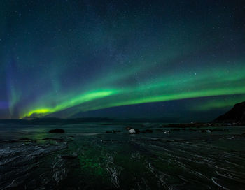 Scenic view of landscape against sky at night