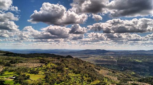 Scenic view of landscape against cloudy sky