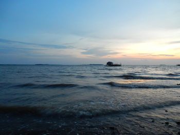 View of calm sea at sunset