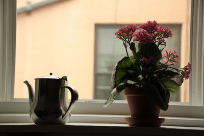 Close-up of flower vase on table at home