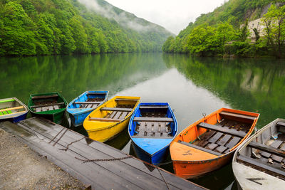 View of boats moored in lake