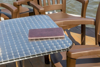 High angle view of empty chairs on table