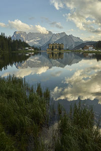 Scenic view of lake and mountains against sky