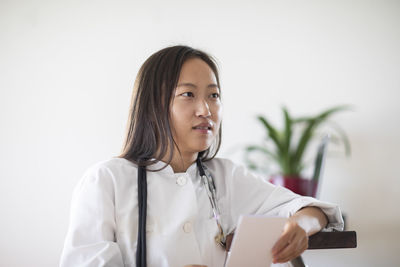 Young asia female doctor with report in a practice