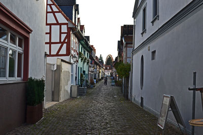 Narrow alley amidst buildings in city