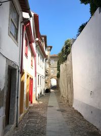 Narrow alley amidst buildings in town