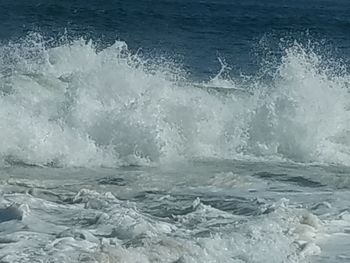 Close-up of waves splashing on sea