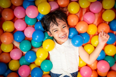 High angle view of woman with colorful balloons