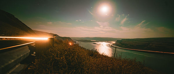 Scenic view of landscape against sky at night