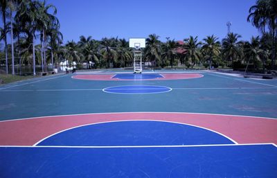 View of basketball hoop against blue sky