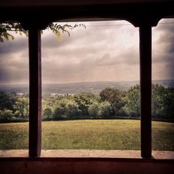 Scenic view of landscape against cloudy sky