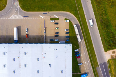 Aerial view of goods warehouse. logistics center in industrial city zone from drone view. background