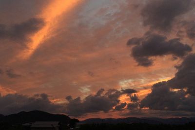 Low angle view of dramatic sky during sunset