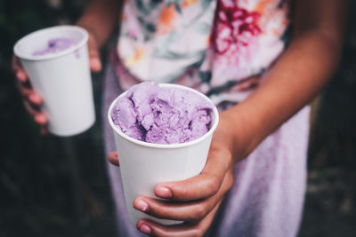 Midsection of person holding ice cream