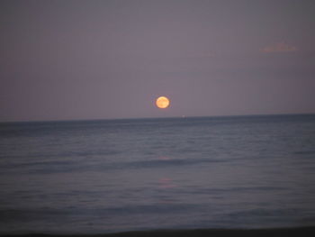 Scenic view of sea against sky at sunset