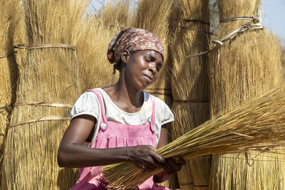 Portrait of smiling woman standing outdoors