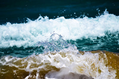 Close-up of waves splashing on shore