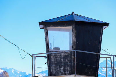 Low angle view of house against clear blue sky