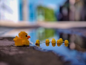 Close-up of yellow toy by building