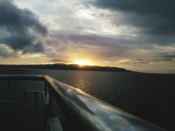 Close-up of sea against sky during sunset