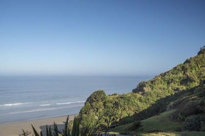 Scenic view of sea against clear blue sky