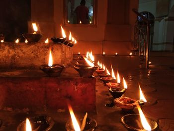 Lit candles in temple