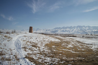 Steppe landscape surrounding burana tower during winter in kyrgyzstan