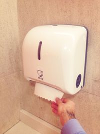 Close-up of woman hand on mirror at home