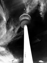 Low angle view of communications tower against sky