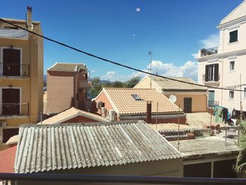 Houses against sky in city