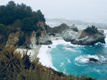 High angle view of rocks in sea