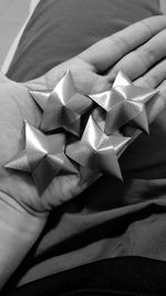 Midsection of person holding star shape decoration