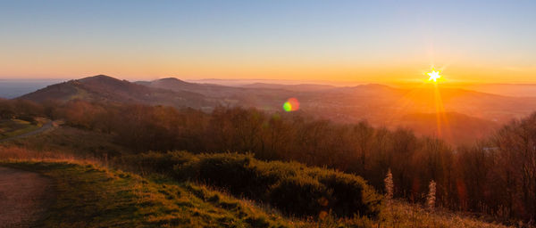 Scenic view of landscape against sky during sunset