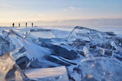 Panoramic view of frozen sea against sky during sunset