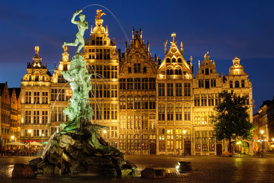 Antwerp grote markt with famous brabo statue and fountain at night, belgium