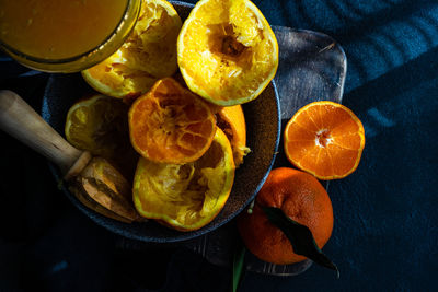High angle view of orange fruits in bowl on table