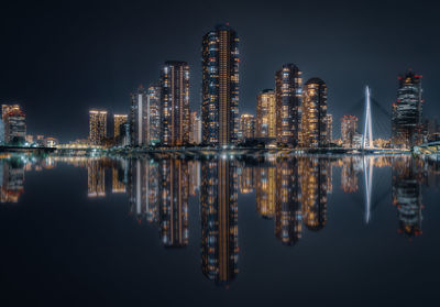 Illuminated buildings in city at night