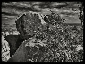 Scenic view of landscape against cloudy sky