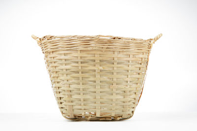 Close-up of wicker basket against white background